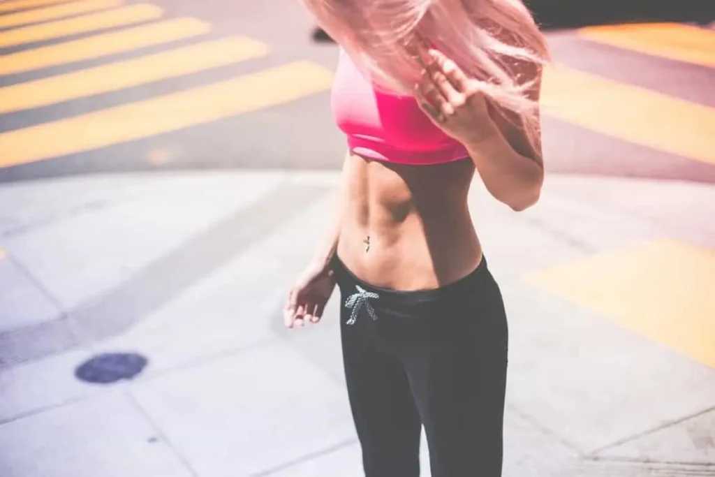 Woman with toned stomach after LA-EMS Body Sculpting Treatment Farthingstone